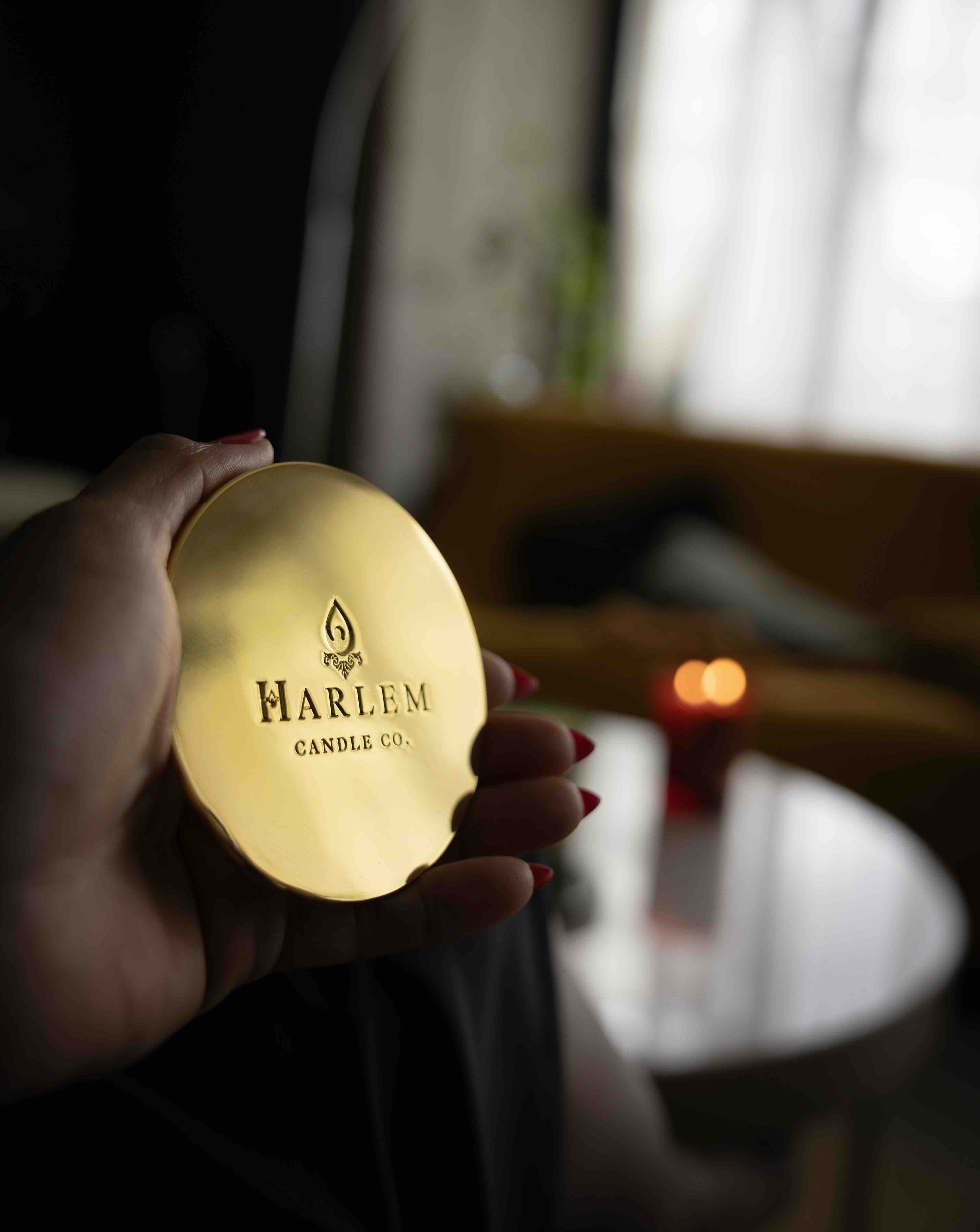 This is a lifestyle image of our gold candle lid.